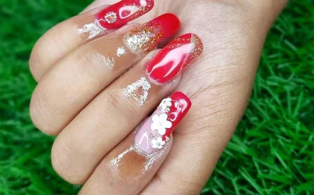 Bold Red and Gold Nail Extensions with 3D Floral Charm – A Statement Look