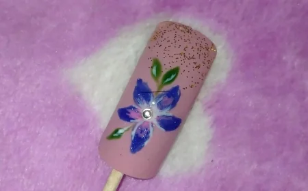 Blue Blossom Floral Nail Art on Nude Base – A Hand-Painted Beauty