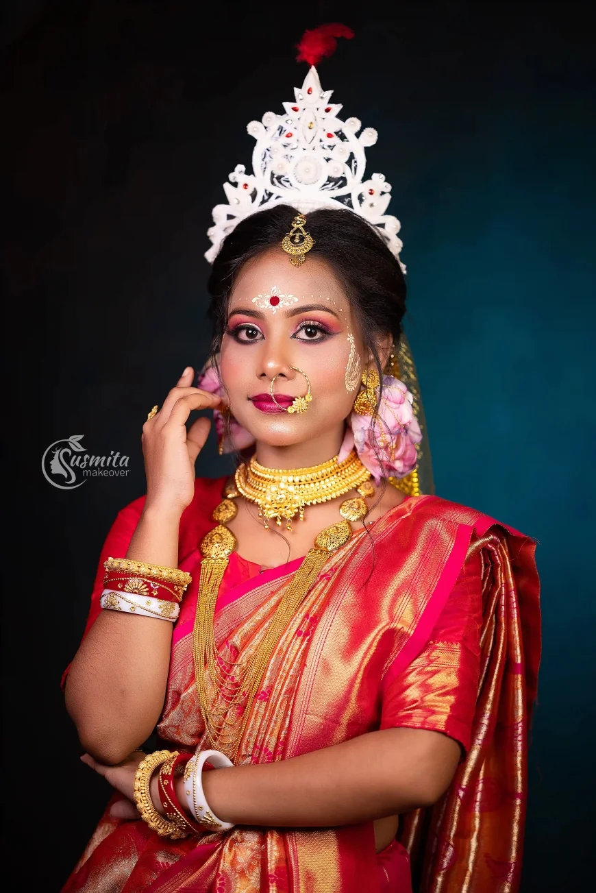 The Divine Glow of a Bengali Bride A Timeless Red & Gold Makeup Story